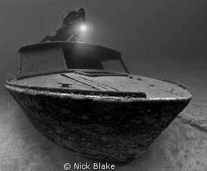Boat wreck and diver
Wraysbury lake, Middlesex, UK.
 by Nick Blake 
